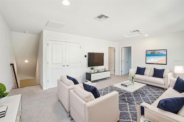 living room with light colored carpet, visible vents, and recessed lighting