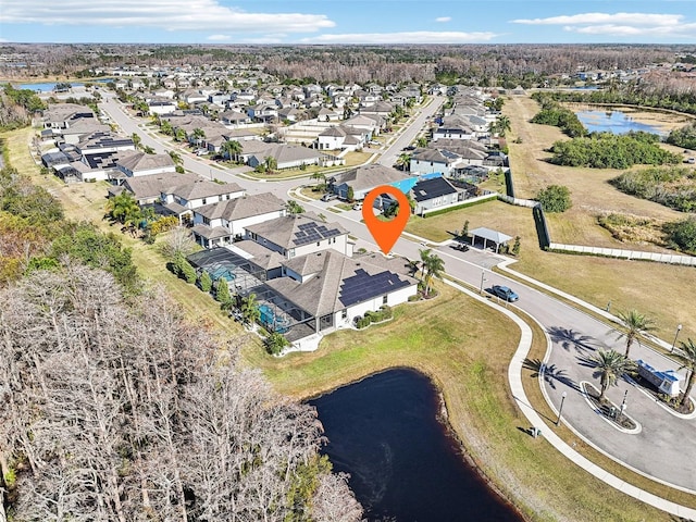 bird's eye view featuring a water view and a residential view