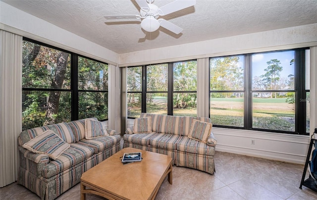 sunroom / solarium featuring ceiling fan and a healthy amount of sunlight