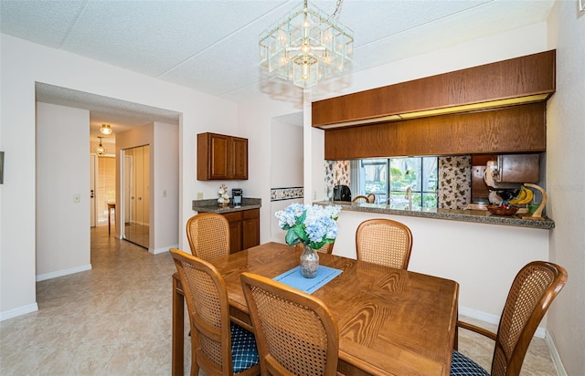 dining space with a chandelier