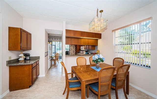 dining space featuring a chandelier