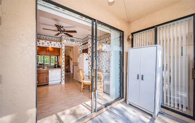 interior space featuring ceiling fan