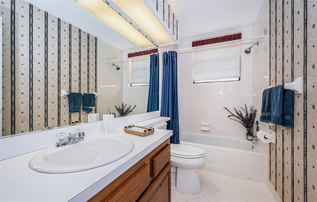 full bathroom featuring tile patterned flooring, vanity, toilet, and shower / bathtub combination with curtain