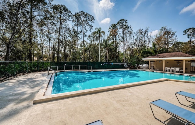 view of swimming pool with a patio area