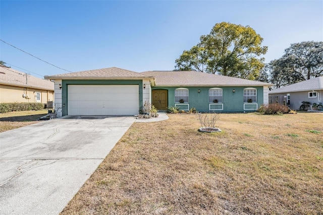 ranch-style house with a garage and a front lawn