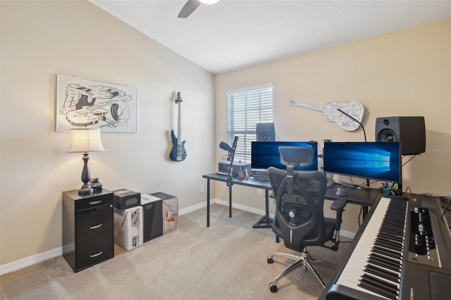 office area with ceiling fan, light colored carpet, and lofted ceiling