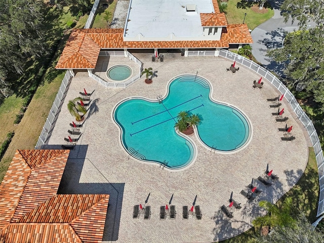 view of swimming pool with a community hot tub and a patio