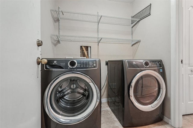 laundry room with independent washer and dryer