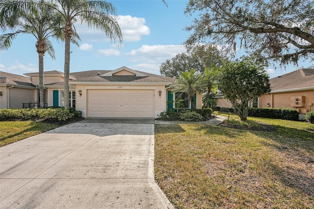 single story home with a garage and a front yard