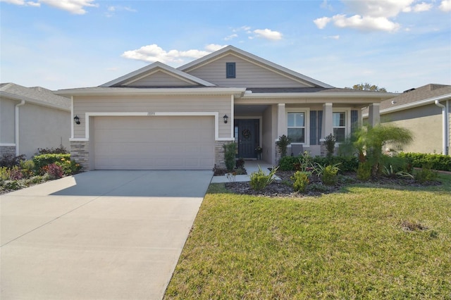 view of front of house featuring a garage and a front lawn