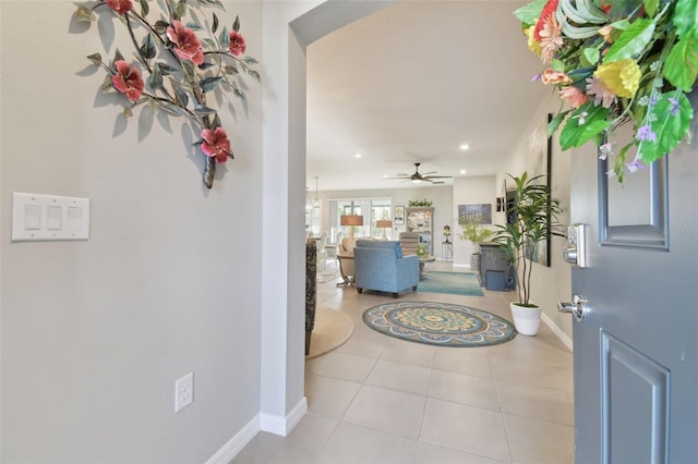 tiled foyer entrance featuring ceiling fan