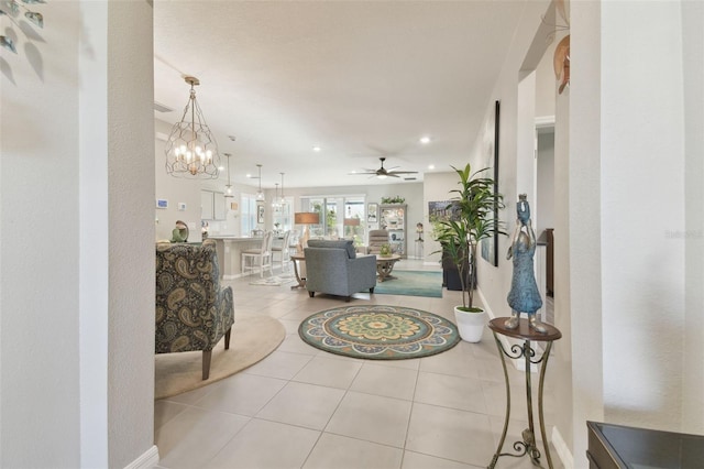 corridor with a chandelier and light tile patterned floors