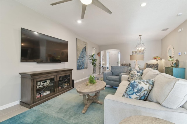 tiled living room with ceiling fan