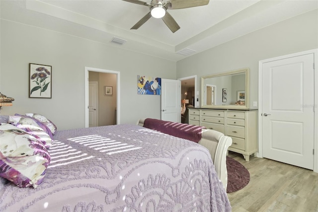 bedroom with ceiling fan and light wood-type flooring