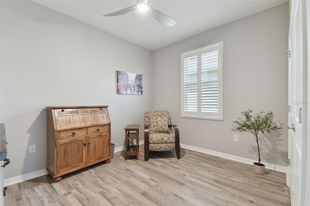 sitting room featuring light hardwood / wood-style flooring and ceiling fan