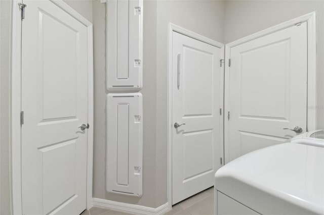 tiled bedroom with a closet