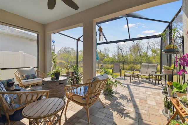 sunroom / solarium with ceiling fan