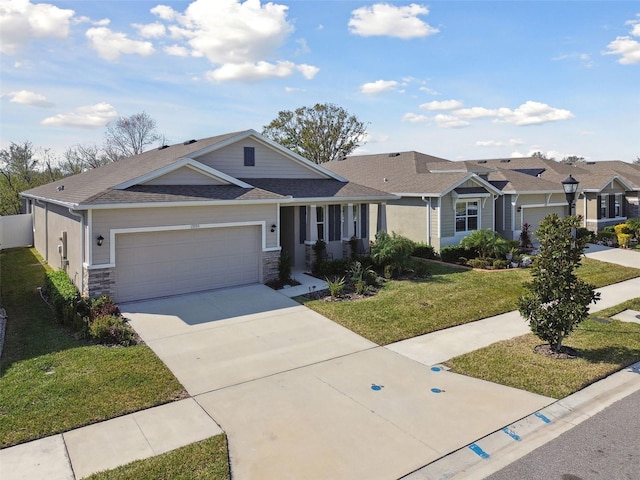 view of front of home with a garage and a front yard