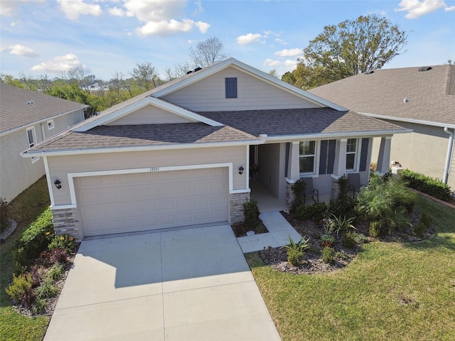 view of front of home featuring a garage and a front yard