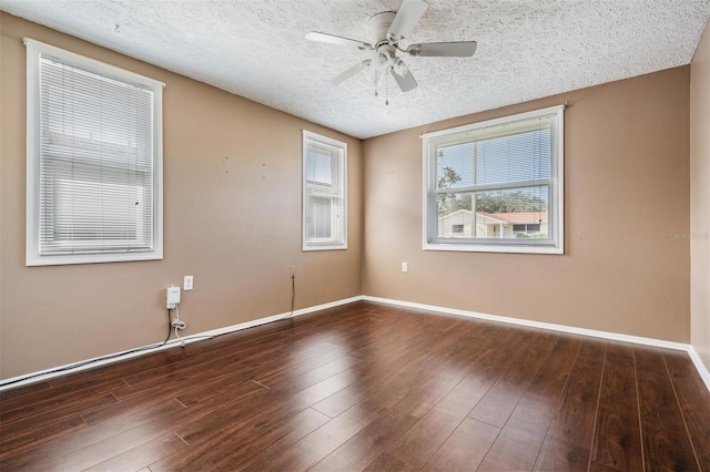 unfurnished room featuring ceiling fan, dark hardwood / wood-style floors, and a textured ceiling