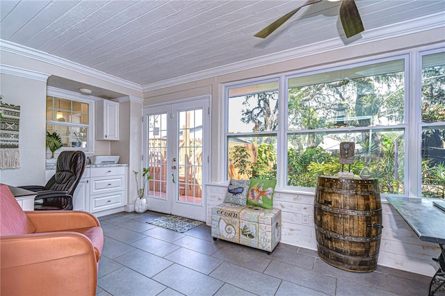 sunroom with french doors and ceiling fan