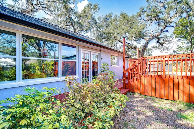 view of side of home with a deck