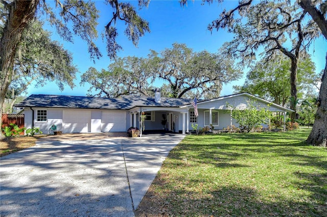 ranch-style house with a garage and a front yard