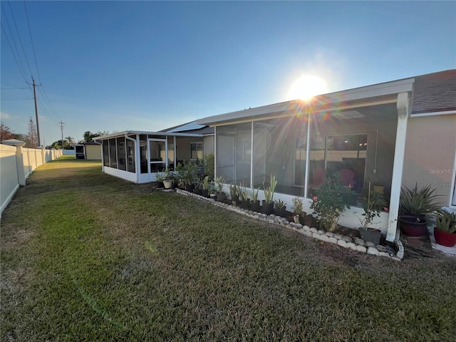 view of yard with a sunroom