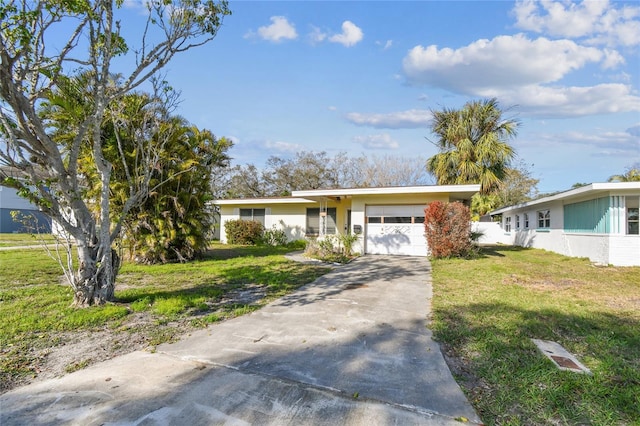 single story home with a garage and a front lawn