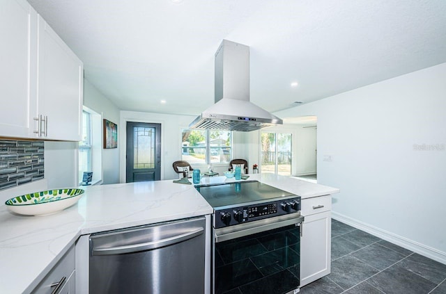 kitchen featuring white cabinets, light stone countertops, island exhaust hood, and stainless steel appliances