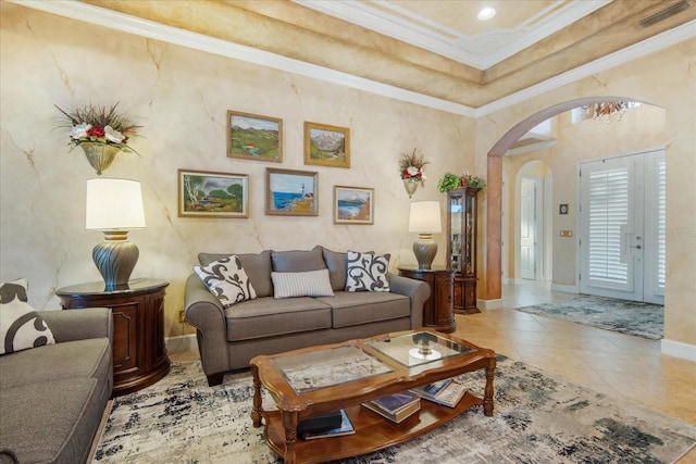 living room featuring light tile patterned floors and crown molding