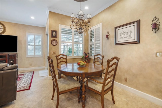 tiled dining space featuring crown molding and an inviting chandelier