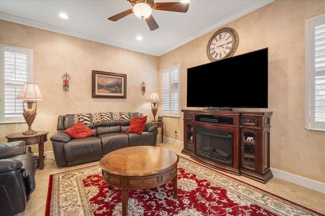 living room featuring ceiling fan and ornamental molding