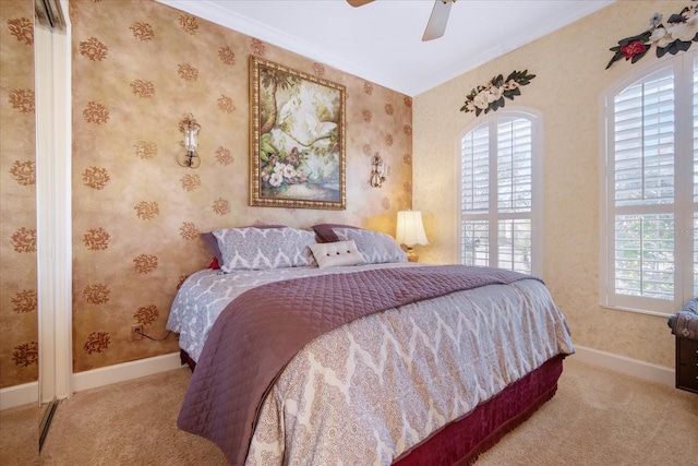 carpeted bedroom featuring ceiling fan and multiple windows