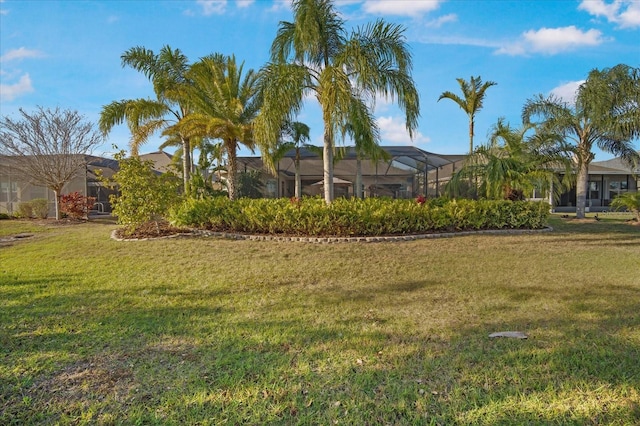 view of yard with a lanai