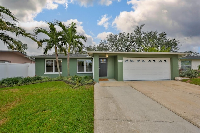 ranch-style home with a garage and a front yard