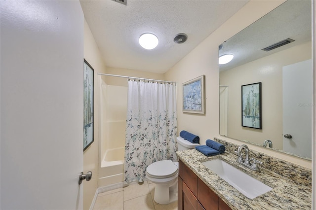 full bathroom featuring shower / tub combo with curtain, vanity, toilet, tile patterned floors, and a textured ceiling