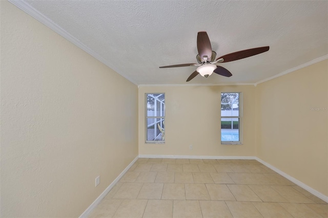 empty room featuring ceiling fan, ornamental molding, and a textured ceiling