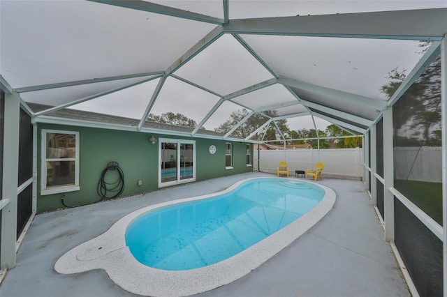 view of pool featuring a lanai and a patio