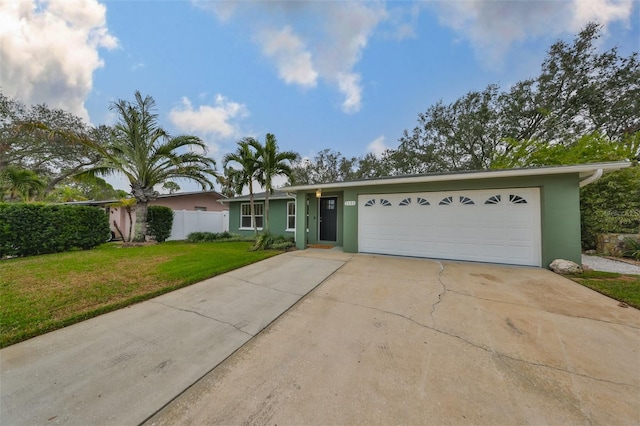 ranch-style home with a garage and a front yard