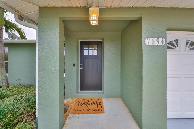 doorway to property featuring a garage