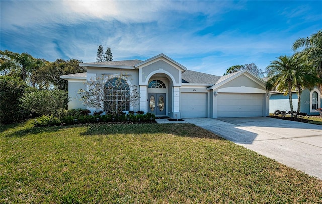 ranch-style house with a garage and a front lawn