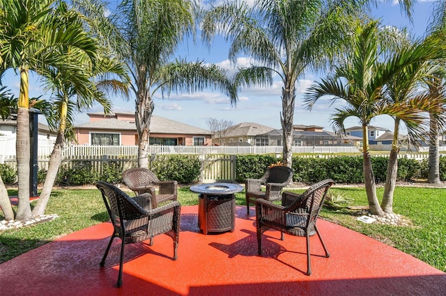 view of patio / terrace featuring a fire pit and fence