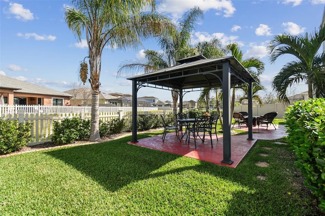 view of yard featuring a gazebo, fence private yard, and a patio