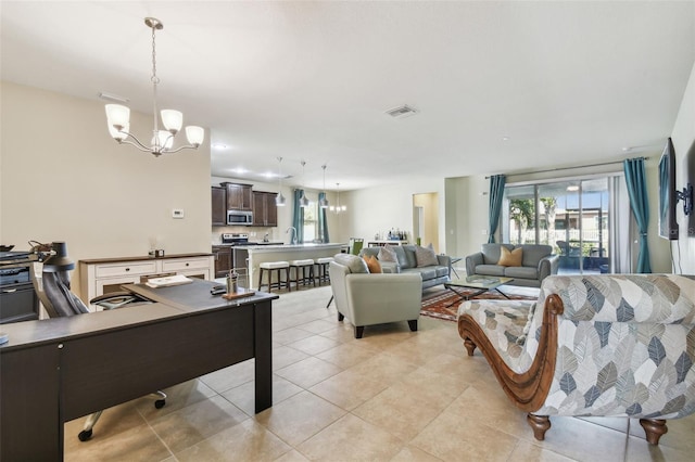 living room featuring a healthy amount of sunlight, light tile patterned floors, and a chandelier