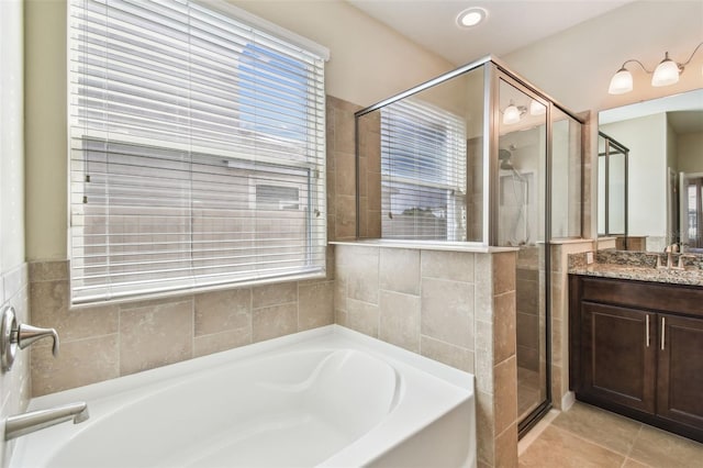 bathroom featuring vanity, separate shower and tub, and tile patterned flooring