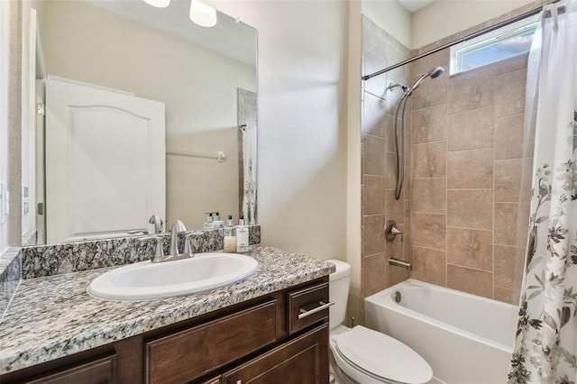 bathroom featuring shower / tub combo with curtain, vanity, and toilet