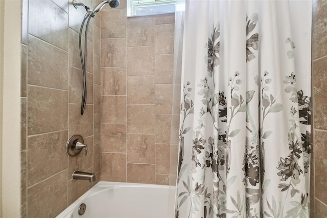 bathroom with shower / bath combination with curtain