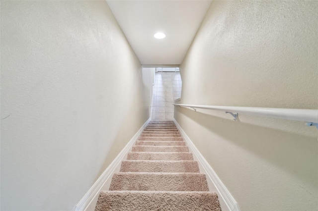 staircase with baseboards