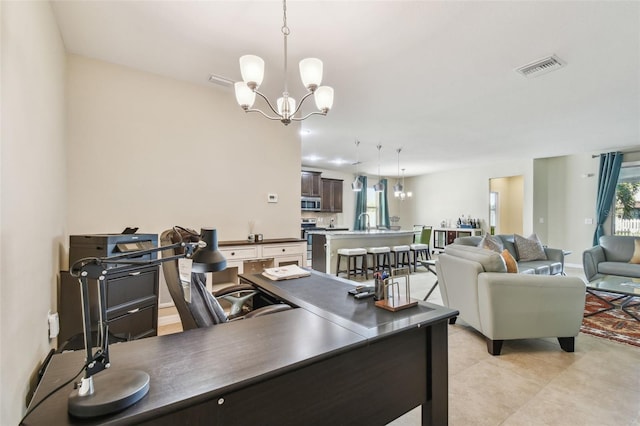 home office featuring a notable chandelier and light tile patterned floors